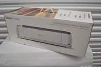 Box front showing Cricut Maker Ultimate Smart Cutting Machine