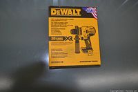 Front view of sealed DeWALT DCD991B box showing model and branding