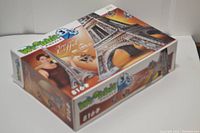 Photo showing the original cardboard box of the puzzle with Wrebbit 3D branding and image of assembled Eiffel Tower puzzle.