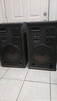 Pair of Audio Digital 5500ER speakers side by side, showing overall size and condition with visible grey felt covering and black speaker grills.