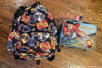 Photo showing Harry Potter backpack, lunch box with attached plastic thermos, keychains included