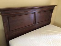 Close-up of solid cherry headboard panels and crown molding
