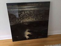 Frontal view of the full painting leaning against wall showing entire artwork and glare.