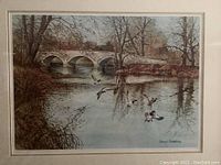 Close-up of print showing river mallards, stone bridge, signature at bottom right corner.