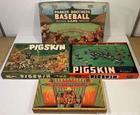 Photo showing all four board game boxes: Parker Brothers Baseball Game 1950, two Pigskin editions (1946 and 1956), and Parchesi 1942.