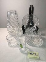 Photo showing the full set of 5 crystal pieces including vase, bowls, shot glass, and plate on stand