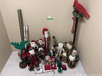 Overview of all Christmas decorations and gift wrap showing grouped items on floor