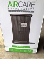 Front of product box showing AirCare evaporative humidifier model EP9800CN image and branding