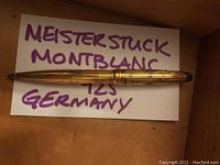 Full-length view of Montblanc Meisterstück pen showing gold-plated ribbed pattern