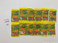 Twelve unopened vintage Slug Pog packs in original yellow-green packaging arranged in two rows.