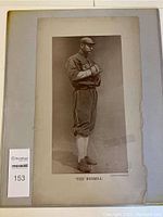 Full front view of the poster showing Tex Russell standing in baseball uniform with arms crossed.