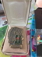 Balfour Atlanta 1996 Opening Ceremony pin displayed in original box with slightly dented lid.