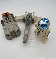 Photo shows all three items: R2 D2, X-Wing Fighter, and Imperial Troops Transport, arranged together on a white background.