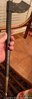 Full-length view of leather-covered scabbard with brass tip