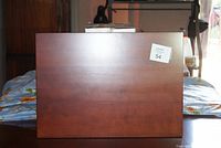 Front view of Bombay TV swivel tray wooden surface with dark brown finish and product tag number.