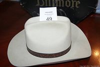 Light cream cowboy hat with dark patterned hatband