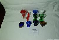 Full set including eyewashers, mini Coke bottles, salt dish, measured cup arranged on white cloth