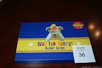Blue box of 'Way Too Funny! Humor Cards' by Marion Heath showing front and top view with image of dog with a clown nose on lid.