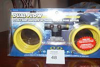 Front view of SeaSense Dual Flow Motor Flush System kit in sealed packaging showing yellow hoses, T-connector, and branding.
