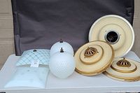Photo showing all seven lighting items including two square glass shades, two hobnail globes, and two saucer-shaped fixtures
