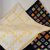 Vintage quilt and crocheted throw displayed together to show overall condition and size.