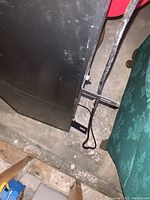 Side view showing the black casing and mounting bracket with power cable.