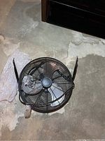 Top view of the floor fan showing metal guard cage and blades