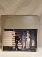 Front of Boz Scaggs vinyl record album cover showing photograph of Boz Scaggs and sculpture.