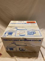 Photo of the original Foster's Light Skydome Cooler box showing the product name and slogan with a graphic of the cooler.
