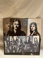 Front cover of Foreigner vinyl record showing two prominent band members and the band name.