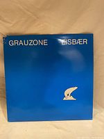 Front of blue Grauzone Eisbar vinyl record cover with polar bear graphic.