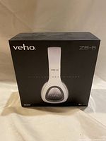 Front view of the sealed box showing Veho ZB-6 wireless headphones printed on the front.