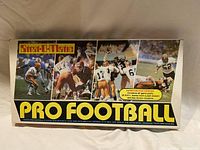 Front side of the vintage Strat-o-matic Pro Football game box showing photos of NFL players and branding