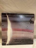 Front of album cover showing aircraft wing with title Wings over America