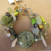 Close up of the multifaceted stone beads and toggle clasp closure of the necklace.