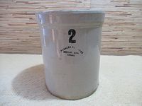 Front view of gray ceramic crockery pot showing stamped marks and capacity number 2.