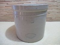 Front view of the beige crockery pot showing embossed number 3 and oval Medalta Pottery Ltd. Medicine Hat imprint near base.