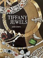 Cover of 'Tiffany Jewels' by John Loring showing detailed jewelry arrangement.