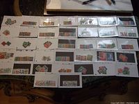 Full overview photo showing multiple stock cards filled with used German stamps arranged in rows on a table.