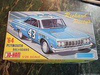 Photo of the box front showing the blue 1964 Plymouth Belvedere race car illustration with Richard Petty's name and car number 43.