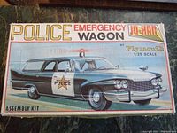 Top box lid showing Plymouth Police Emergency Wagon artwork and Jo-Han branding