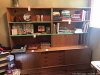 Front view showing base cabinet and two upper shelving units assembled