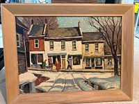 Front view of framed print depicting winter Main Street scene