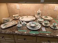 Countertop display of platters, gravy boats, salt and pepper, rectangular dishes