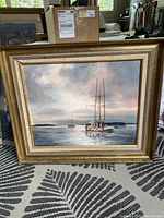 Full view of framed painting depicting sailboats on water