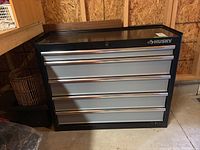 Front view showing five drawers and Husky logo