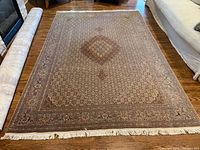 Full view of the rug laid flat on hardwood floor