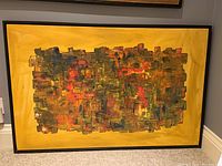 Full view of framed painting against grey wall