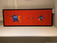 Full front view showing entire painting and black floating frame