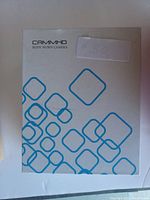 CAMMHD branded white box with blue geometric patterns, showing the packaging of the body worn camera.
